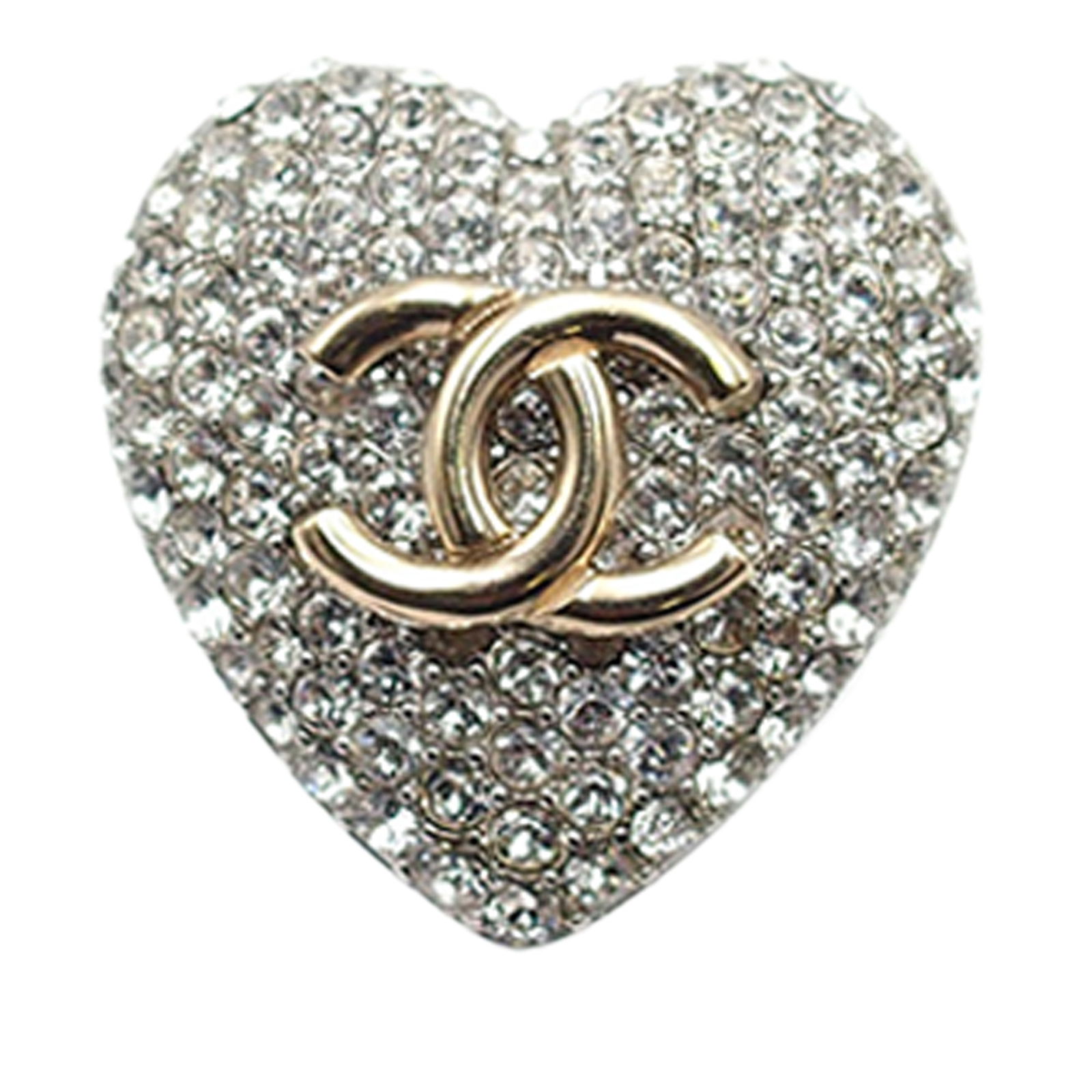 Chanel Silver Plated Crystal CC Heart Ring Italy: Chanel Silver Plated Crystal CC Heart Ring Italy This exquisite Chanel ring showcases a stunning silver-tone metal body adorned with a gold-tone CC logo and sparkling crystal embellishments, creating