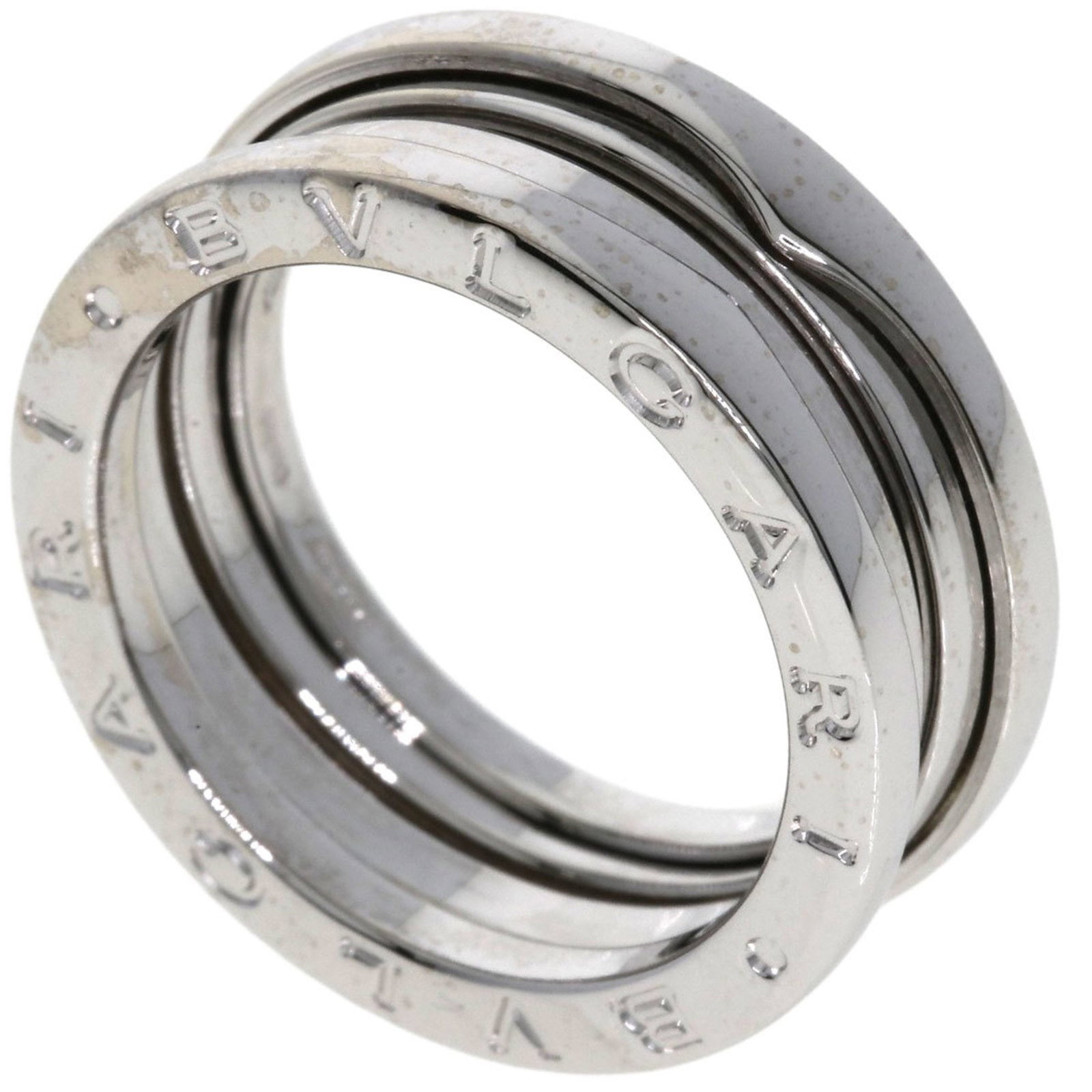 White Gold Bulgari B.Zero1 7.5 Italian Ring Silver Tone: White Gold Bulgari B.Zero1 7.5 Italian Ring Silver Tone This Bulgari B.Zero1 ring features a sleek design crafted from white gold in a silver tone. Designed for women, it has a width of 8.4mm and weig