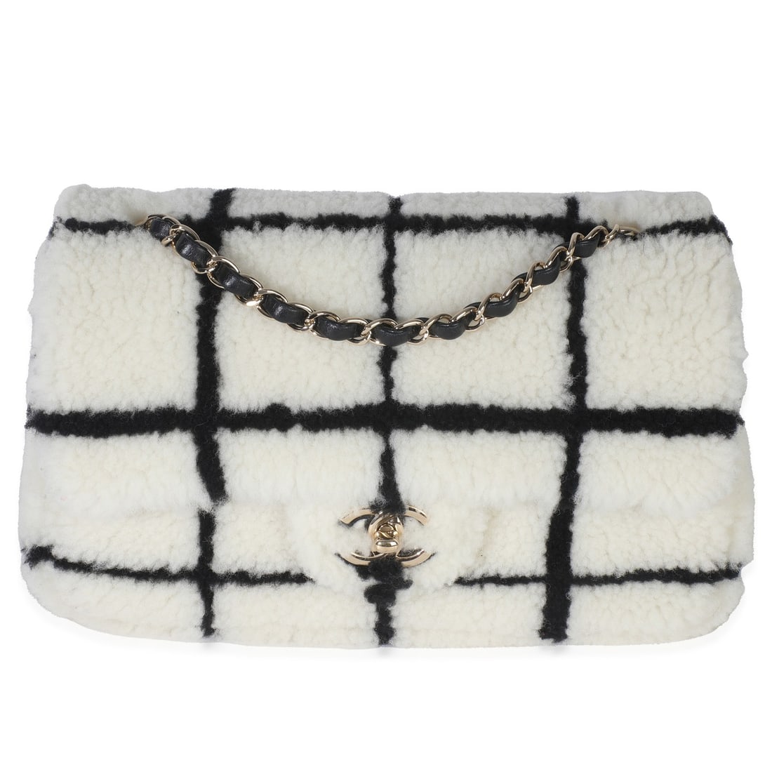 Chanel 2022 Black White Shearling Medium Flap Bag: Chanel 2022 Black White Shearling Medium Flap Bag This Chanel Medium Flap Bag features an elegant black and white CC square print, crafted from luxurious shearling fur. The bag is designed as a should