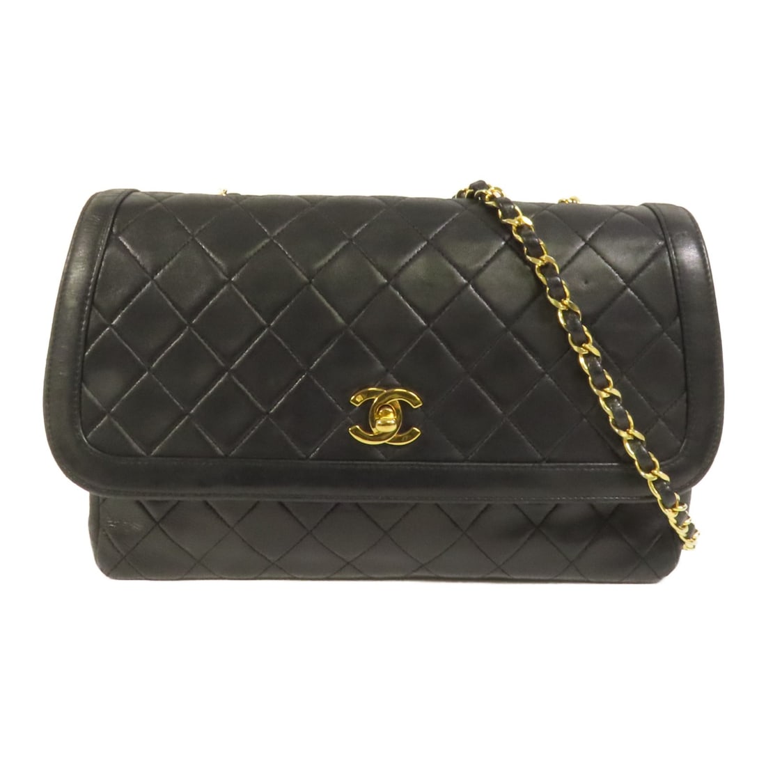 Black Lambskin CHANEL Vintage Shoulder Bag with CC Logo and Gold Hardware: Black Lambskin CHANEL Vintage Shoulder Bag with CC Logo and Gold Hardware This vintage CHANEL shoulder bag features a classic black lambskin leather exterior and gold-tone chain accents. Designed in a