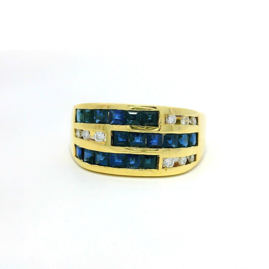 18k Yellow Gold Sapphire Diamond Channel Set Wide Band Ring: 18k Yellow Gold Sapphire Diamond Channel Set Wide Band Ring This stunning wide band ring features a luxurious combination of natural genuine sapphires and diamonds, meticulously channel set in solid 1
