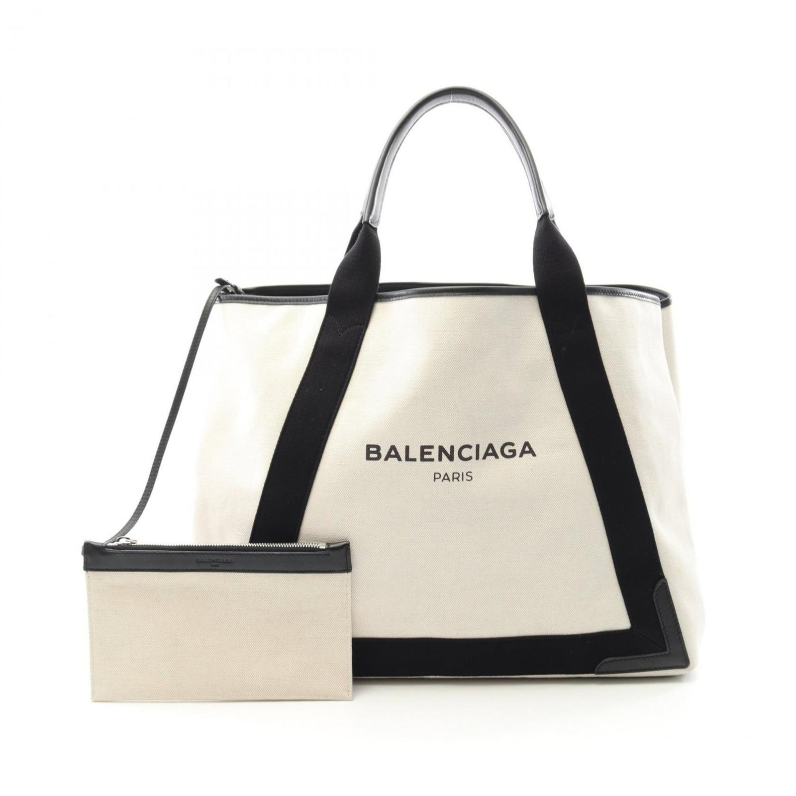 White Canvas Navy Cabas Tote Bag by Balenciaga: White Canvas Navy Cabas Tote Bag by Balenciaga This Balenciaga Navy Cabas is a women's bag crafted from durable white canvas. The bag features a spacious design, making it suitable for everyday use. I