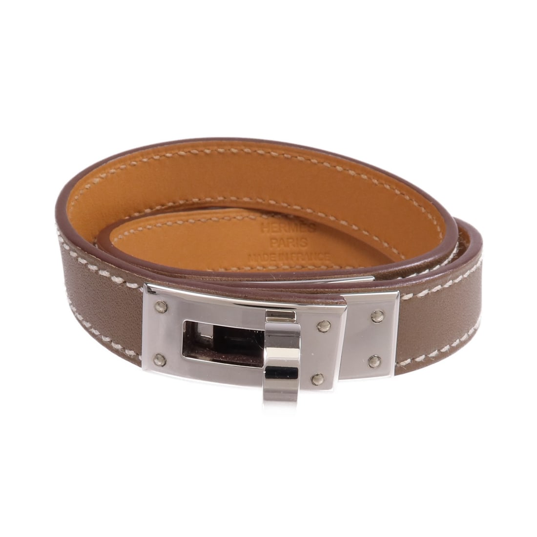 Hermes Kelly Double Tour Etoupe Gray Swift Leather PHW Bracelet: Hermes Kelly Double Tour Etoupe Gray Swift Leather PHW Bracelet This is a Hermes Kelly Double Tour bracelet crafted from Swift calfskin leather in an Etoupe gray color. The bracelet features a double-