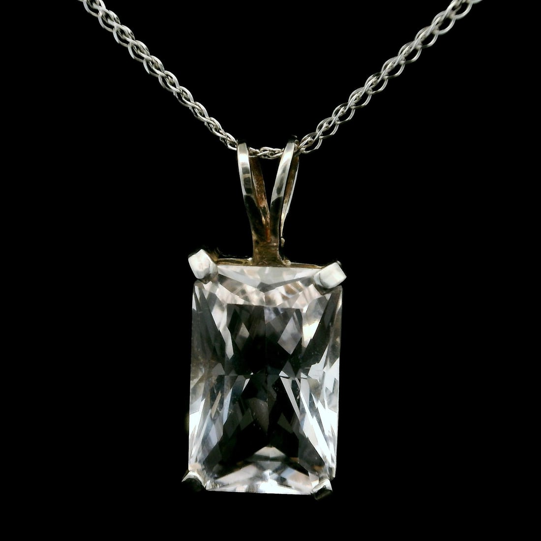 Estate 14k White Gold Clear Beryl Solitaire Pendant Necklace: Estate 14k White Gold Clear Beryl Solitaire Pendant Necklace This elegant pendant necklace features a stunning large faceted clear beryl (Goshenite) solitaire, expertly prong set in lustrous 14k white