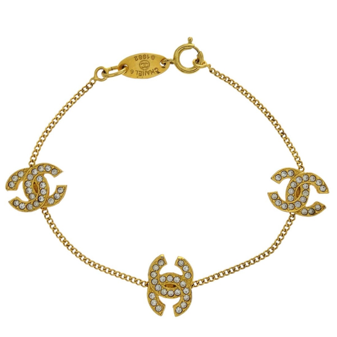 Chanel Gold Plated CC Chain Bracelet with Rhinestones 4022/1982: Chanel Gold Plated CC Chain Bracelet with Rhinestones 4022/1982 This exquisite Chanel CC Chain Bracelet features a stunning gold-plated design adorned with sparkling rhinestones. The iconic CC shape a