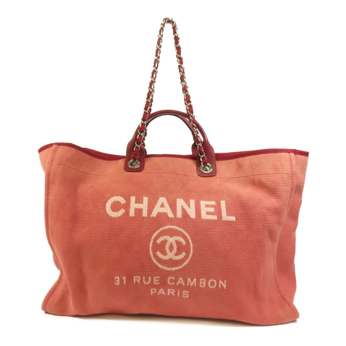 Red Canvas Deauville Extra Large 2Way Tote Shoulder Bag by Chanel: Red Canvas Deauville Extra Large 2Way Tote Shoulder Bag by Chanel This CHANEL Deauville Tote is an extra-large 2-way shoulder bag crafted from red canvas. It features silver-tone hardware and is desig