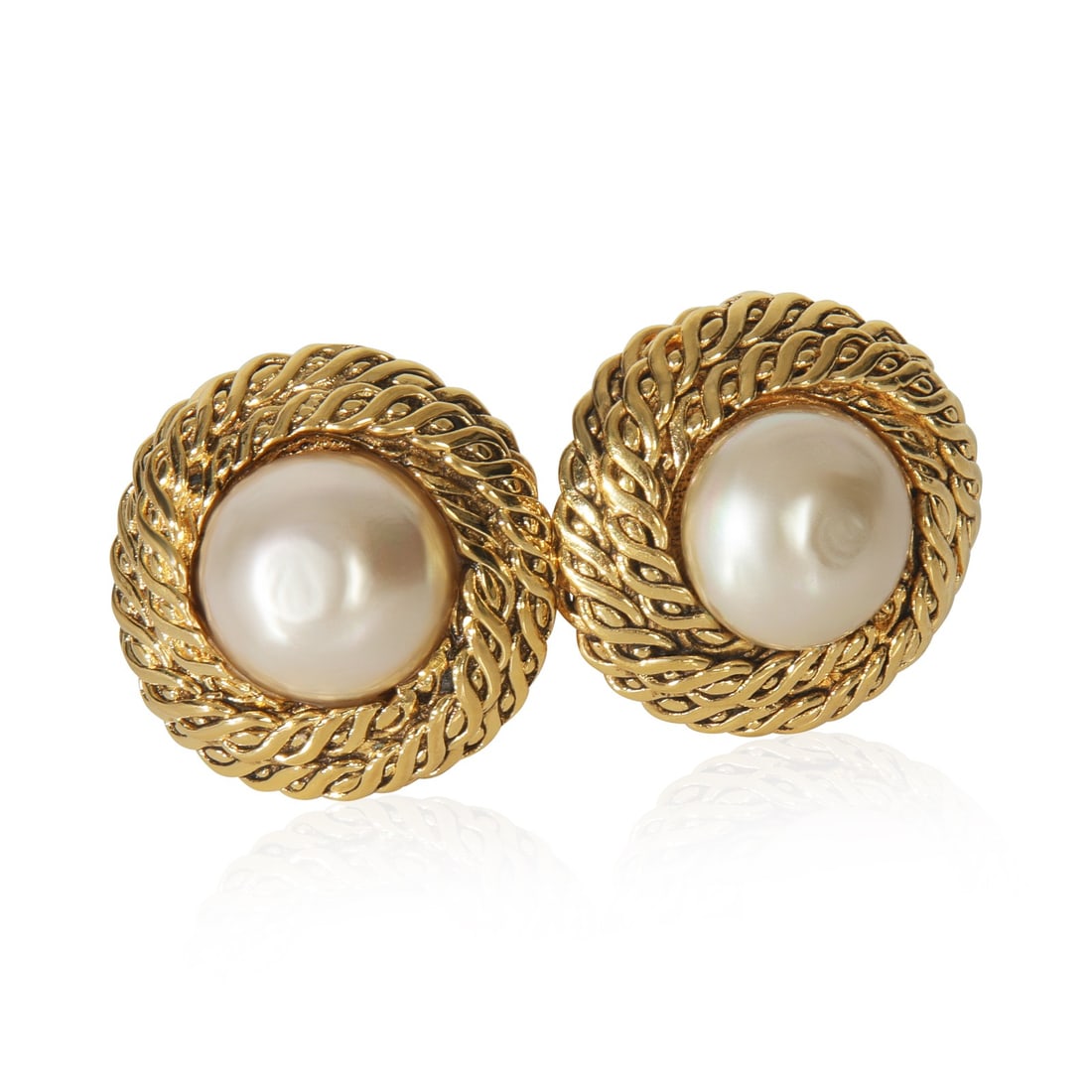 Chanel Vintage 1984 Gold-Plated Faux Pearl Earrings: Chanel Vintage 1984 Gold-Plated Faux Pearl Earrings Enhance your accessory collection with these exquisite vintage 1984 Chanel earrings. Crafted from gold-plated metal, these earrings feature a classi