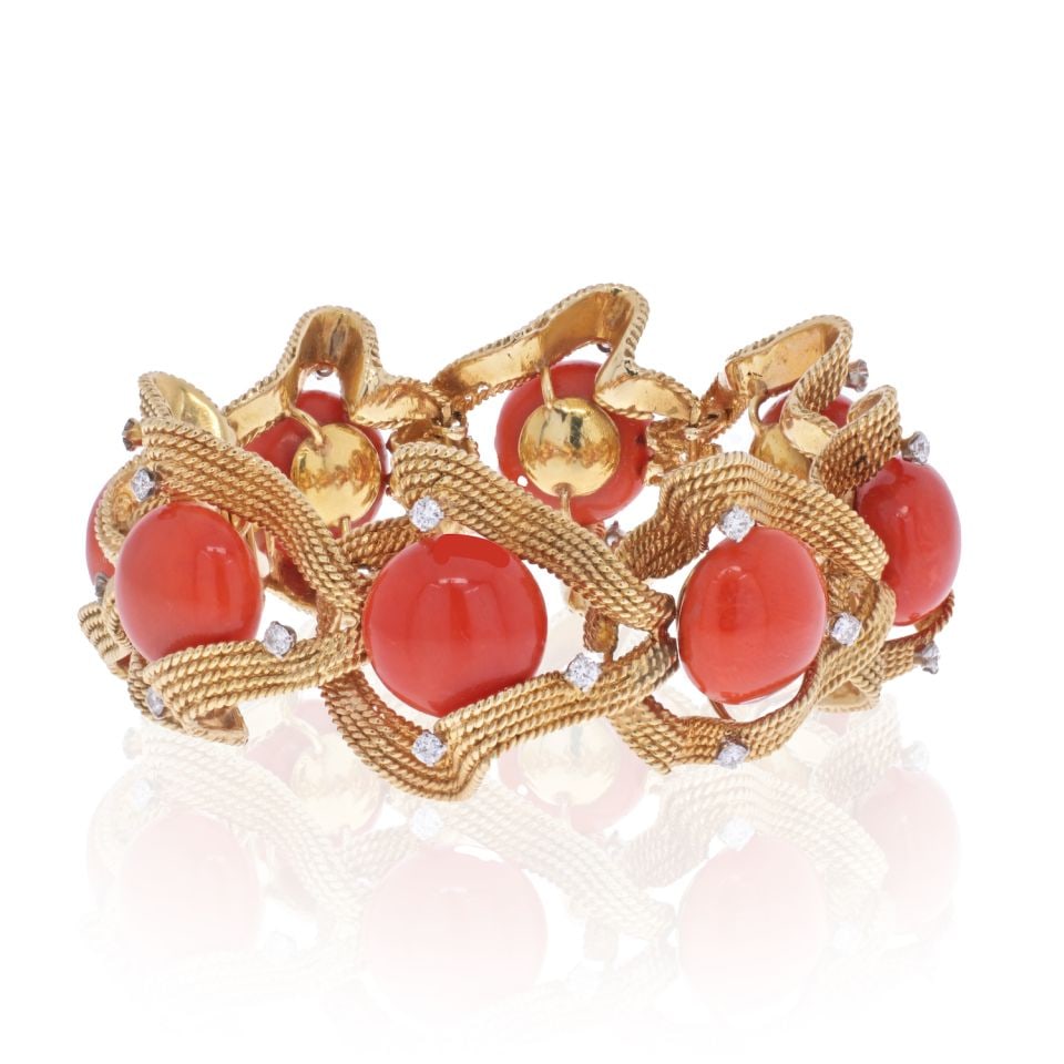 David Webb 1960s 18K Gold Coral Diamond Bracelet Signed Webb: David Webb 1960s 18K Gold Coral Diamond Bracelet Signed Webb This exquisite bracelet from David Webb is a stunning example of 1960s design, crafted from luxurious 18K yellow gold. Featuring flexible l