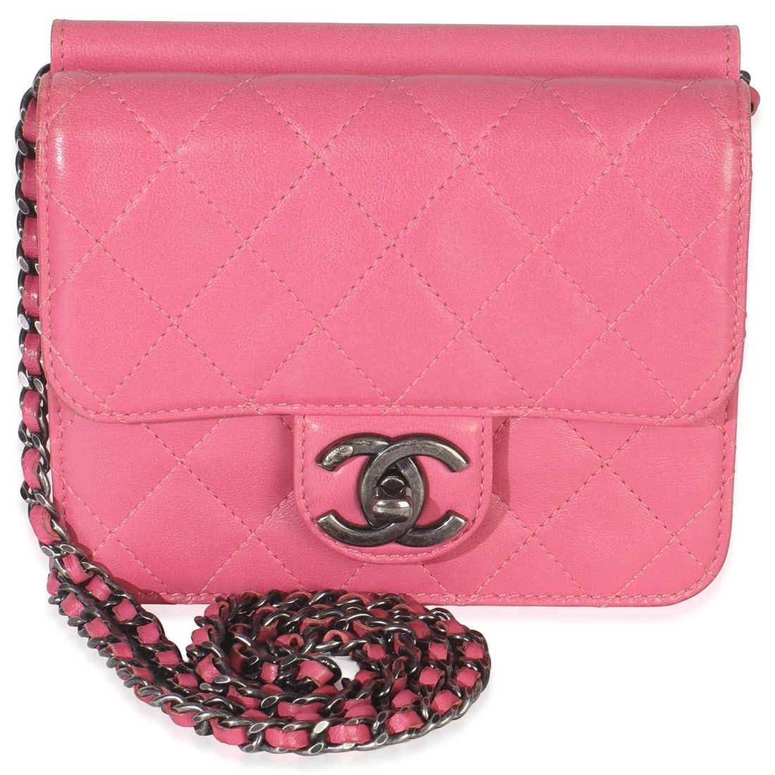 Mini Crossing Times Pink Quilted Leather Flap Bag by Chanel: Mini Crossing Times Pink Quilted Leather Flap Bag by Chanel This Chanel Mini Crossing Times Flap Bag features a pink quilted lambskin leather exterior with gunmetal hardware and a turnlock closure. Th