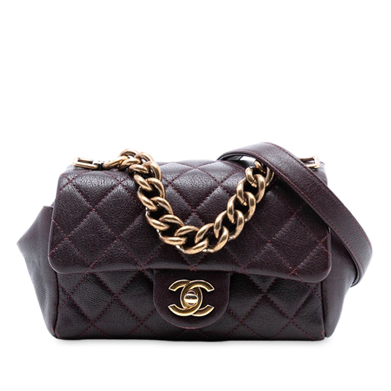 Red Chanel Mini Trapezio Quilted Sheepskin Flap Bag with Chain Handle: Red Chanel Mini Trapezio Quilted Sheepskin Flap Bag with Chain Handle This Chanel Mini Quilted Sheepskin Trapezio Flap bag features a red quilted sheepskin leather body, a curb chain handle, a flat le