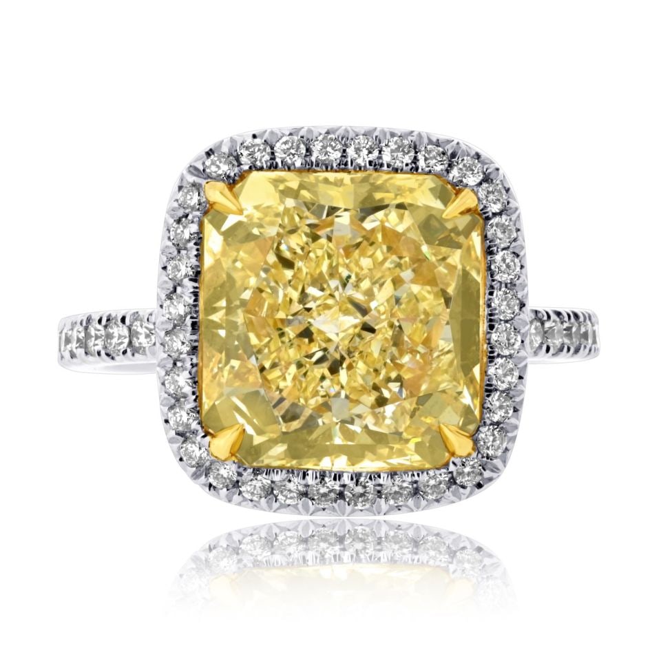 5.28 Carat Radiant Cut Fancy Intense Yellow Engagement Ring: 5.28 Carat Radiant Cut Fancy Intense Yellow Engagement Ring This stunning engagement ring features a magnificent 5.28 carat Radiant Cut Fancy Intense Yellow diamond at its center, surrounded by a halo