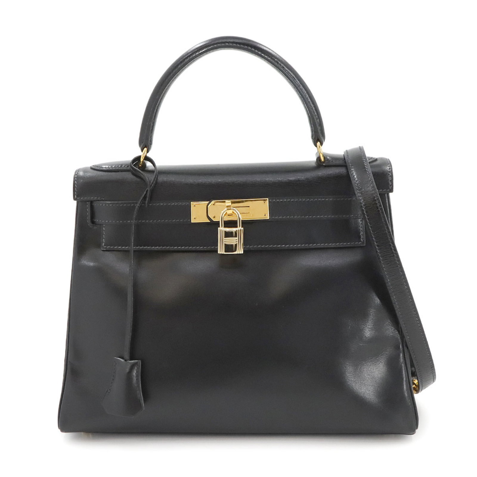 Black Leather Kelly 28 Handbag by Hermes France: Black Leather Kelly 28 Handbag by Hermes France This Hermes Kelly 28 handbag features a classic black leather construction with a structured silhouette. The bag is designed for women and comes from Fr