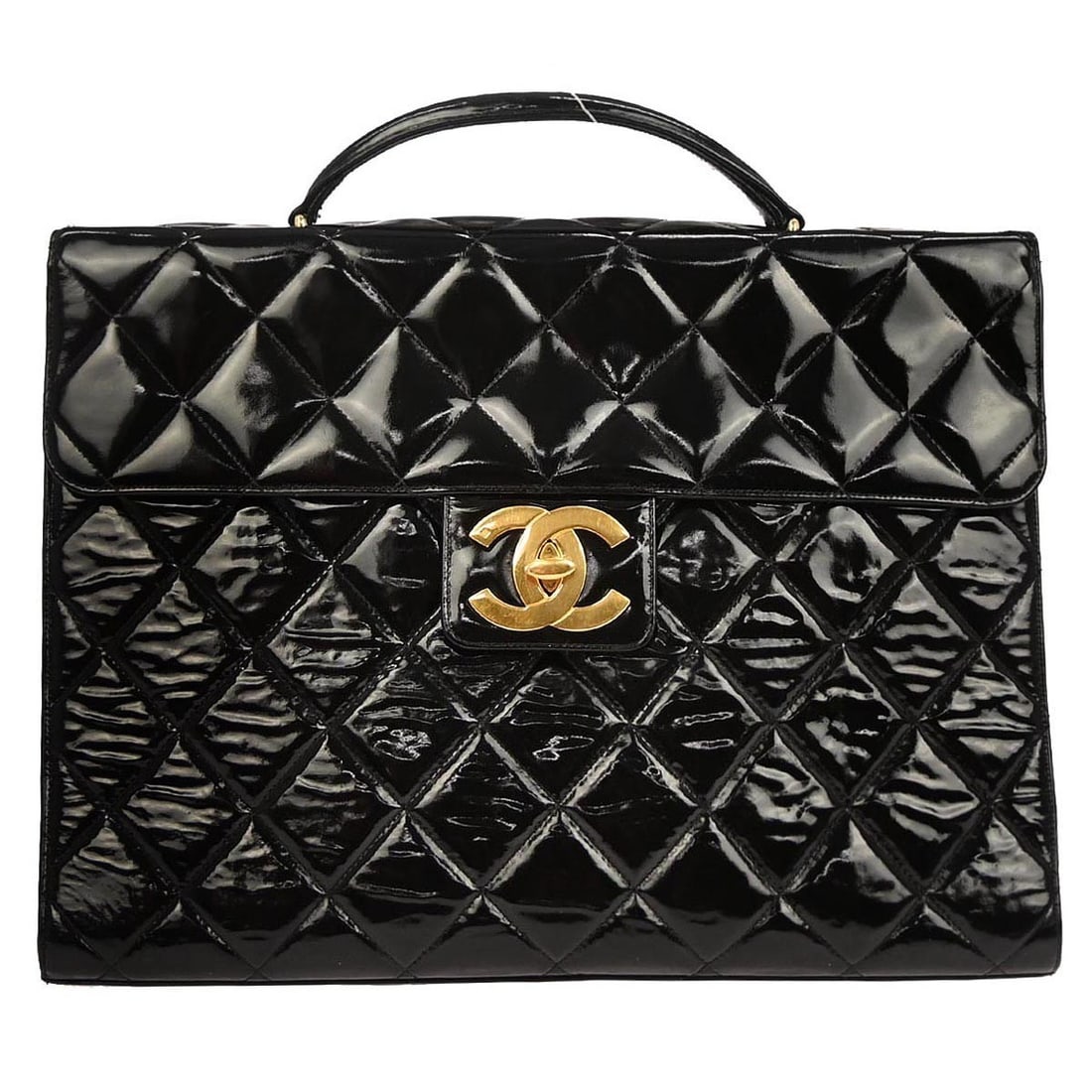 Large Black Patent Leather Briefcase Handbag by Chanel: Large Black Patent Leather Briefcase Handbag by Chanel This Chanel briefcase is crafted from black patent leather and features a top handle design with a turn lock closure. The bag is sized for busine