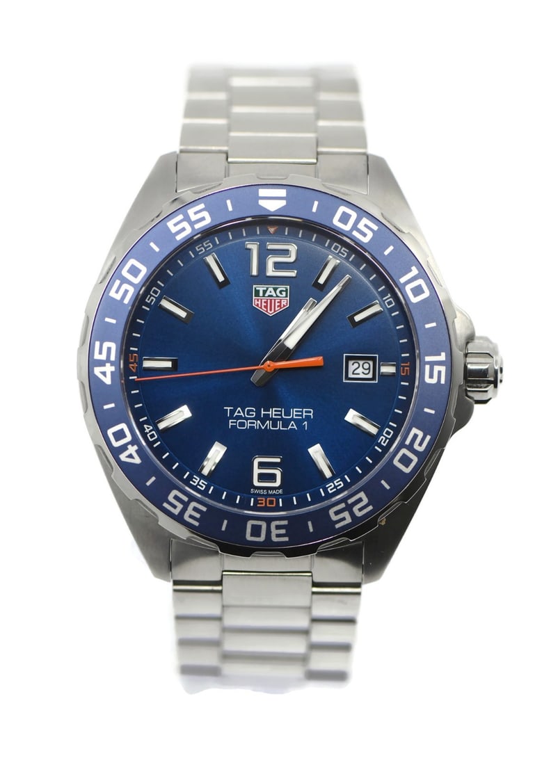 TAG Heuer Formula 1 WAZ1010 Blue Dial Stainless Steel Quartz Wristwatch with Box: TAG Heuer Formula 1 WAZ1010 Blue Dial Stainless Steel Quartz Wristwatch with Box This TAG Heuer Formula 1 wristwatch features a stainless steel case and band with a striking blue analog dial. The watc