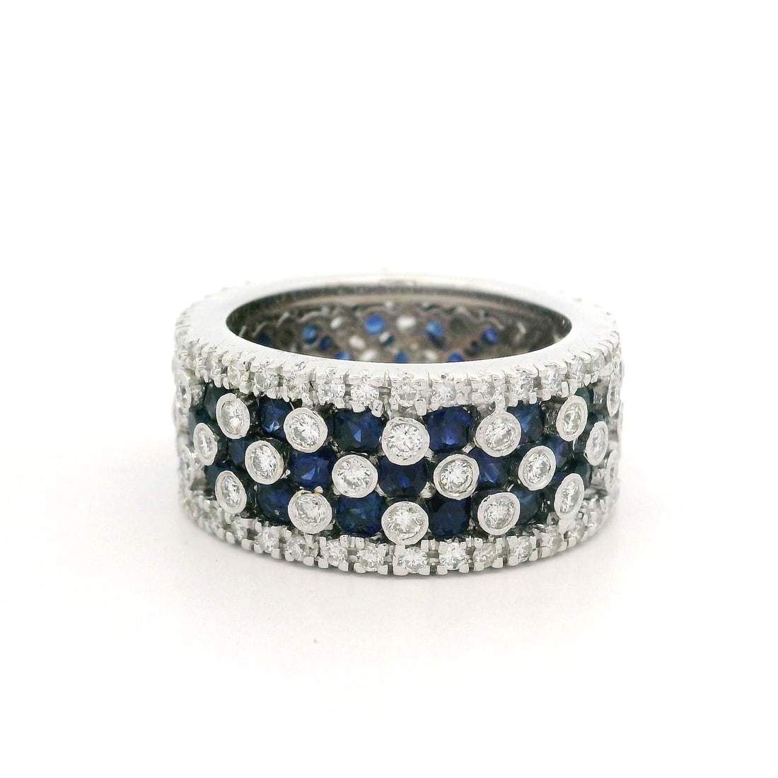 18k White Gold 3.60ctw Sapphire Diamond Eternity Band Ring: 18k White Gold 3.60ctw Sapphire Diamond Eternity Band Ring This stunning 18k white gold wide eternity band ring features an exquisite combination of natural sapphires and diamonds. Set with 48 round b
