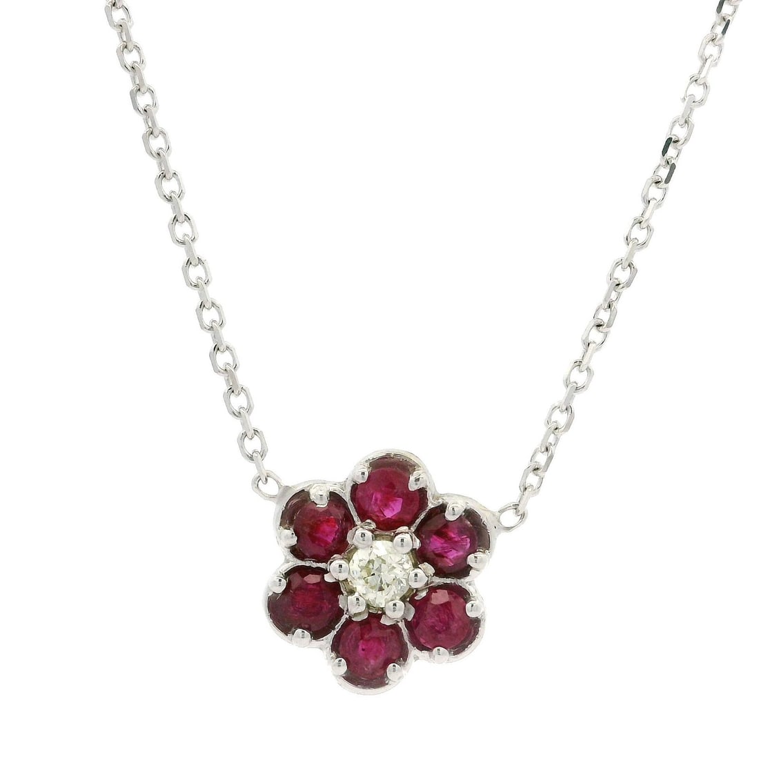 14k White Gold Ruby Diamond Flower Pendant Necklace 1.15ctw: 14k White Gold Ruby Diamond Flower Pendant Necklace 1.15ctw This exquisite pendant necklace features a stunning flower design crafted from 14k white gold. The centerpiece showcases six natural rubies,