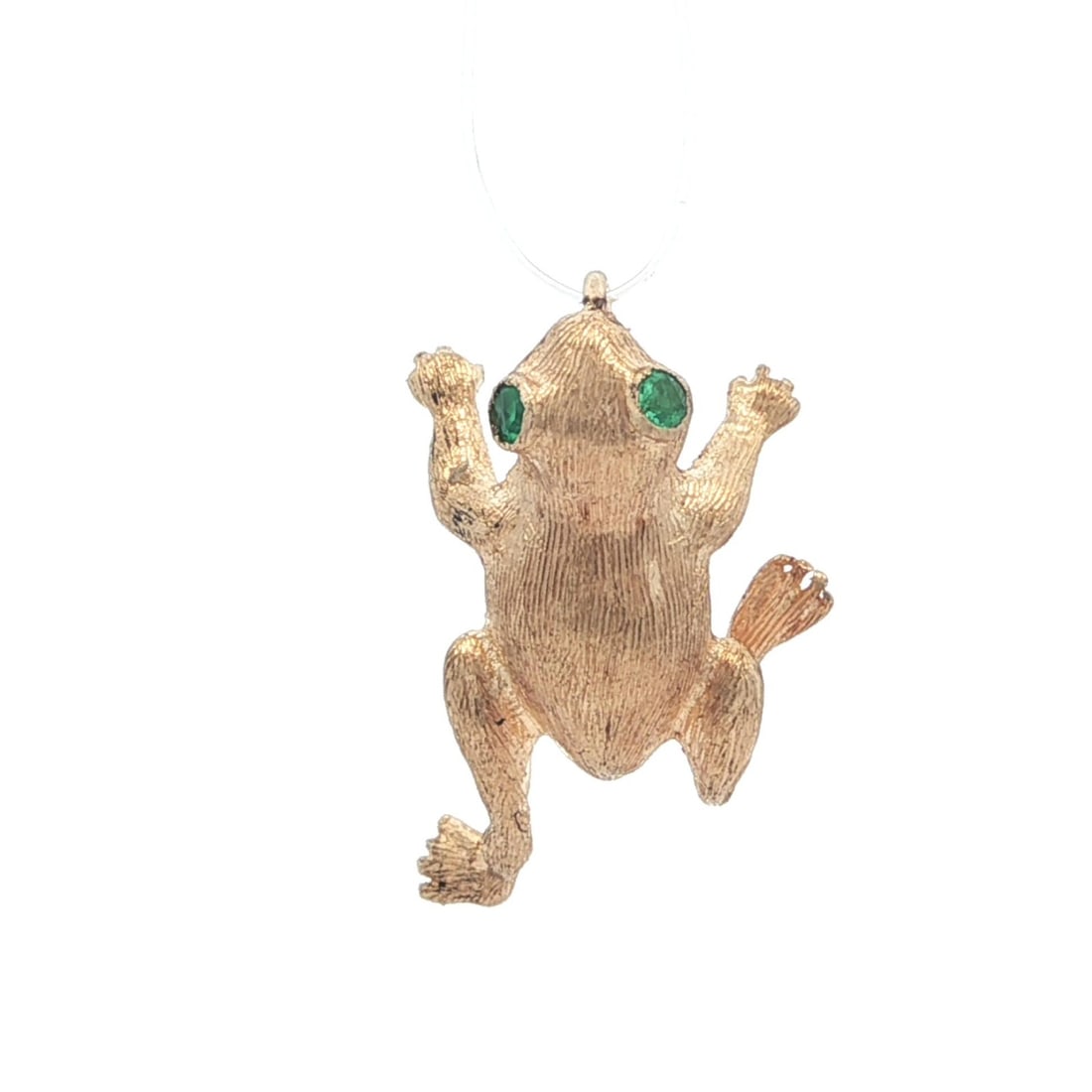 Vintage 14k Yellow Gold Textured Frog Charm with Emerald Eyes: Vintage 14k Yellow Gold Textured Frog Charm with Emerald Eyes This charming vintage pendant features a delightful jumping frog design crafted from solid 14k yellow gold. Adorned with two natural genui