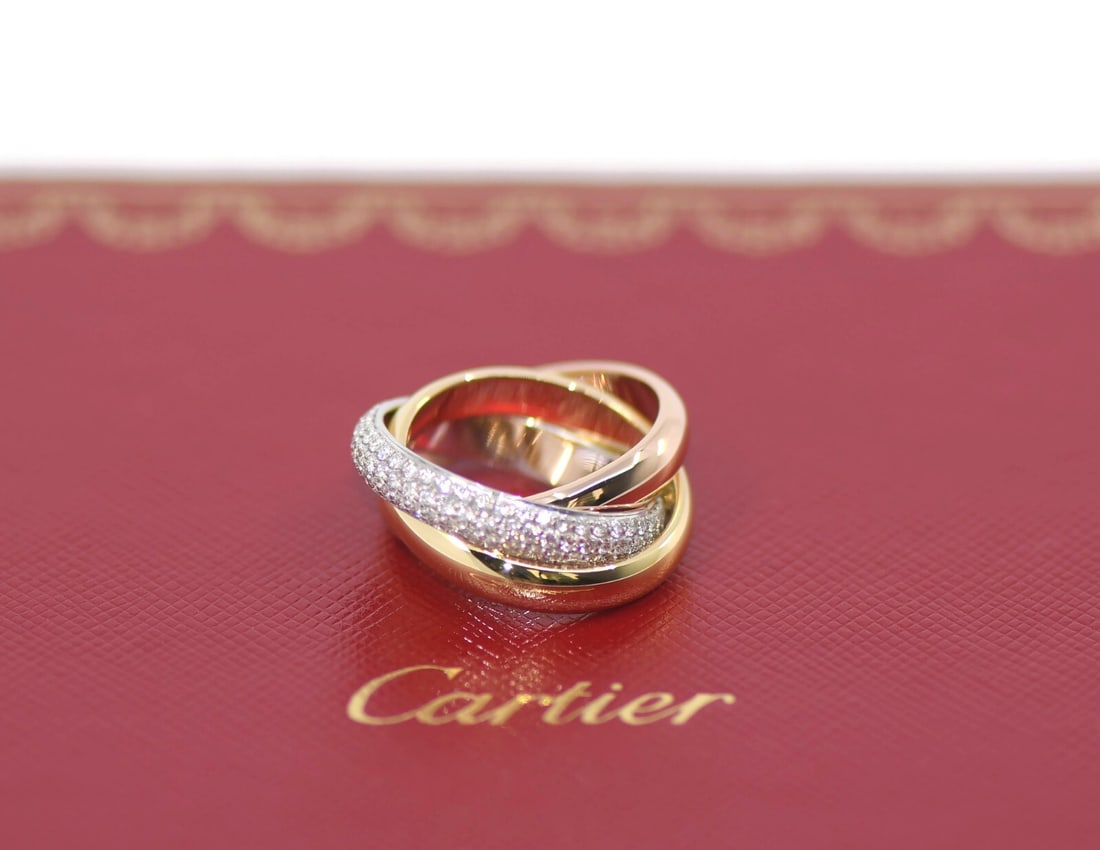 Cartier Trinity Diamond 18K Tri-Color Gold Ring Size 49 with Box: Cartier Trinity Diamond 18K Tri-Color Gold Ring Size 49 with Box This exquisite Cartier Trinity Diamond Ring features a stunning 18K tri-color gold design, expertly crafted to showcase the elegance of