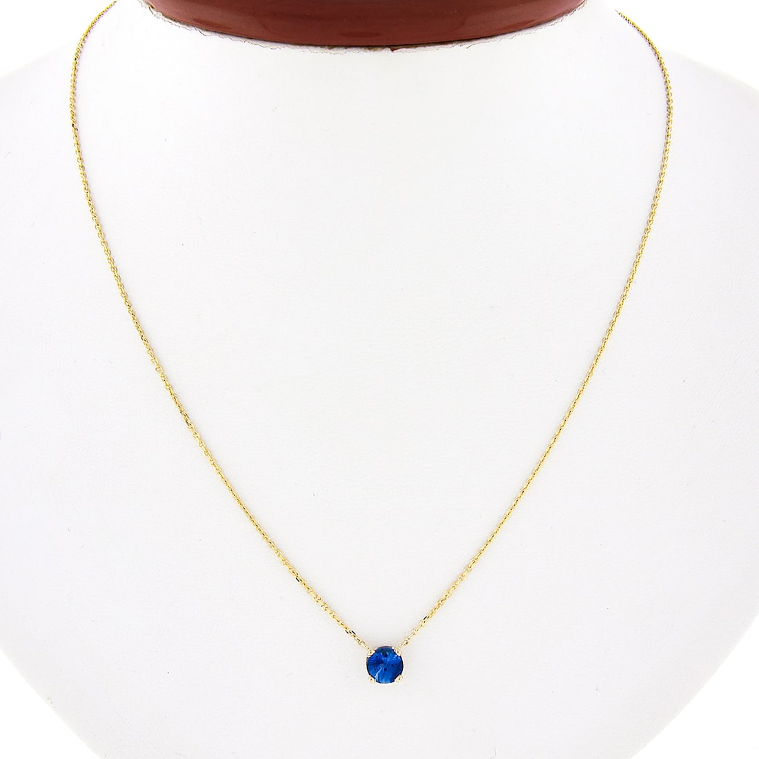 14k Yellow Gold 0.75ct Round Sapphire Solitaire Pendant Necklace: 14k Yellow Gold 0.75ct Round Sapphire Solitaire Pendant Necklace This exquisite pendant necklace features a stunning 0.75ct round brilliant cut sapphire, elegantly set in a solid 14k yellow gold prong