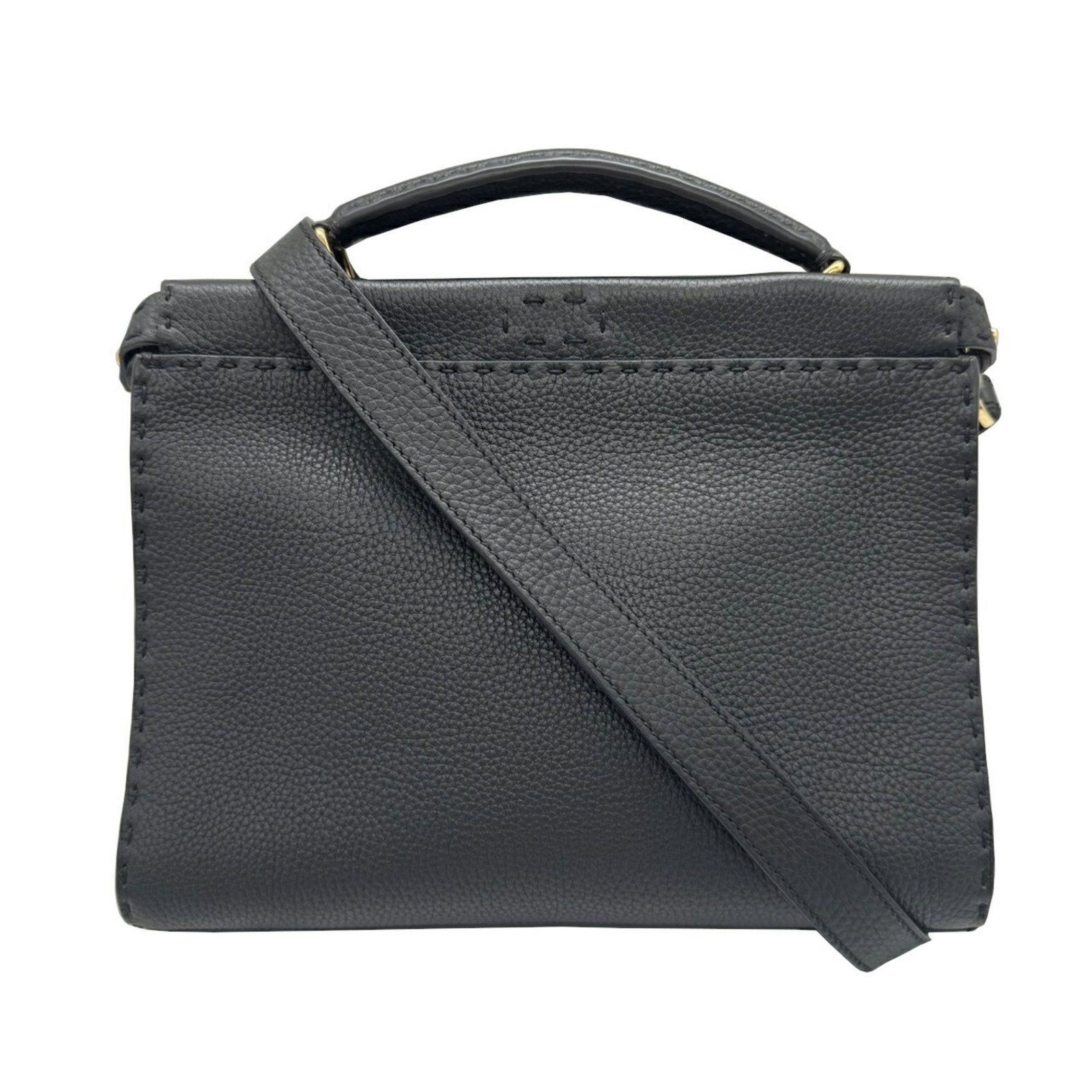 Black Leather Selleria Handbag by Fendi with Adjustable Strap: Black Leather Selleria Handbag by Fendi with Adjustable Strap This Fendi Selleria handbag is crafted from black leather and features a structured silhouette. It offers both a handle and an adjustable