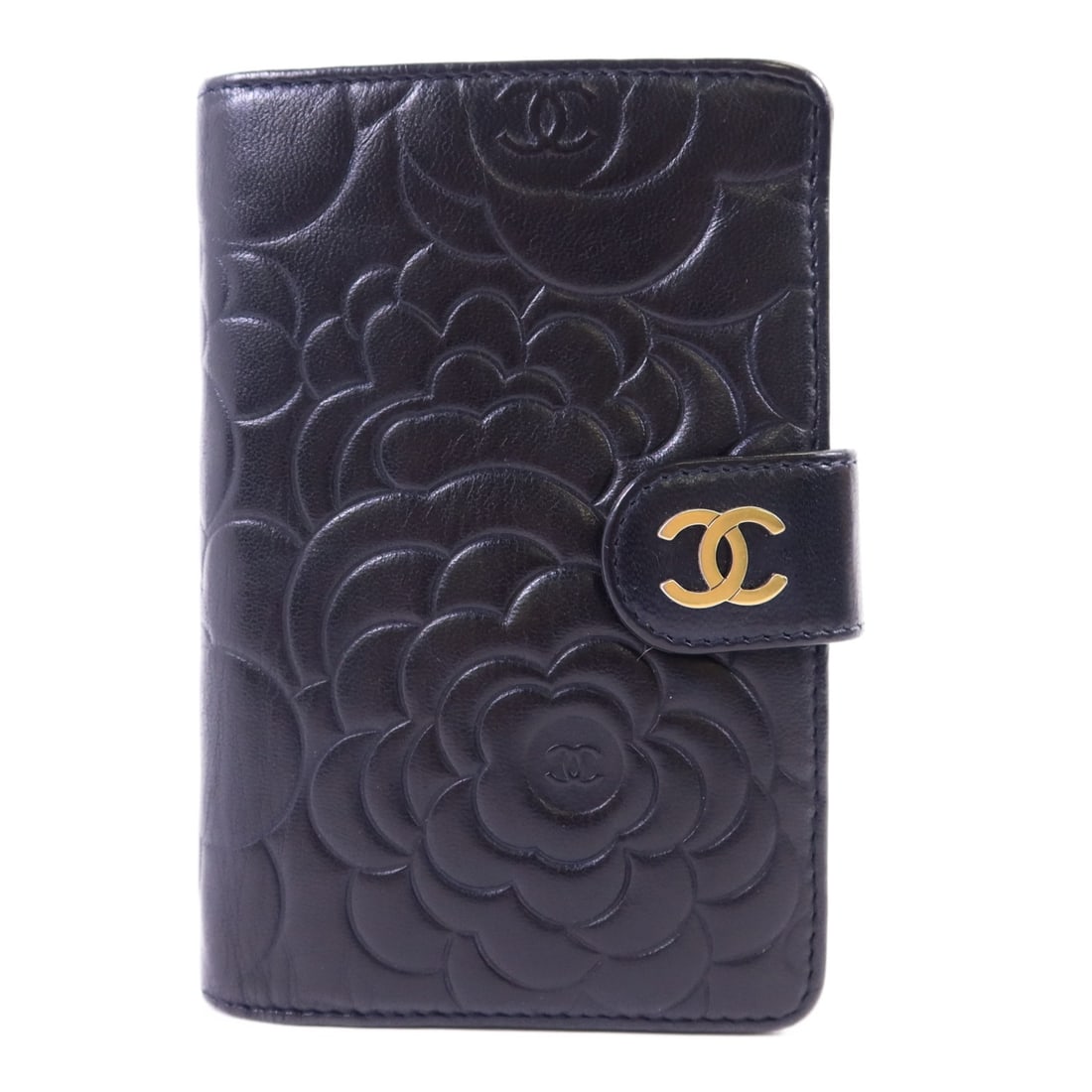 Black Lambskin Bi-Fold Camellia Wallet by CHANEL with Gold Hardware: Black Lambskin Bi-Fold Camellia Wallet by CHANEL with Gold Hardware This CHANEL bi-fold wallet is crafted from black lambskin leather and features the signature Camellia motif. The wallet is equipped