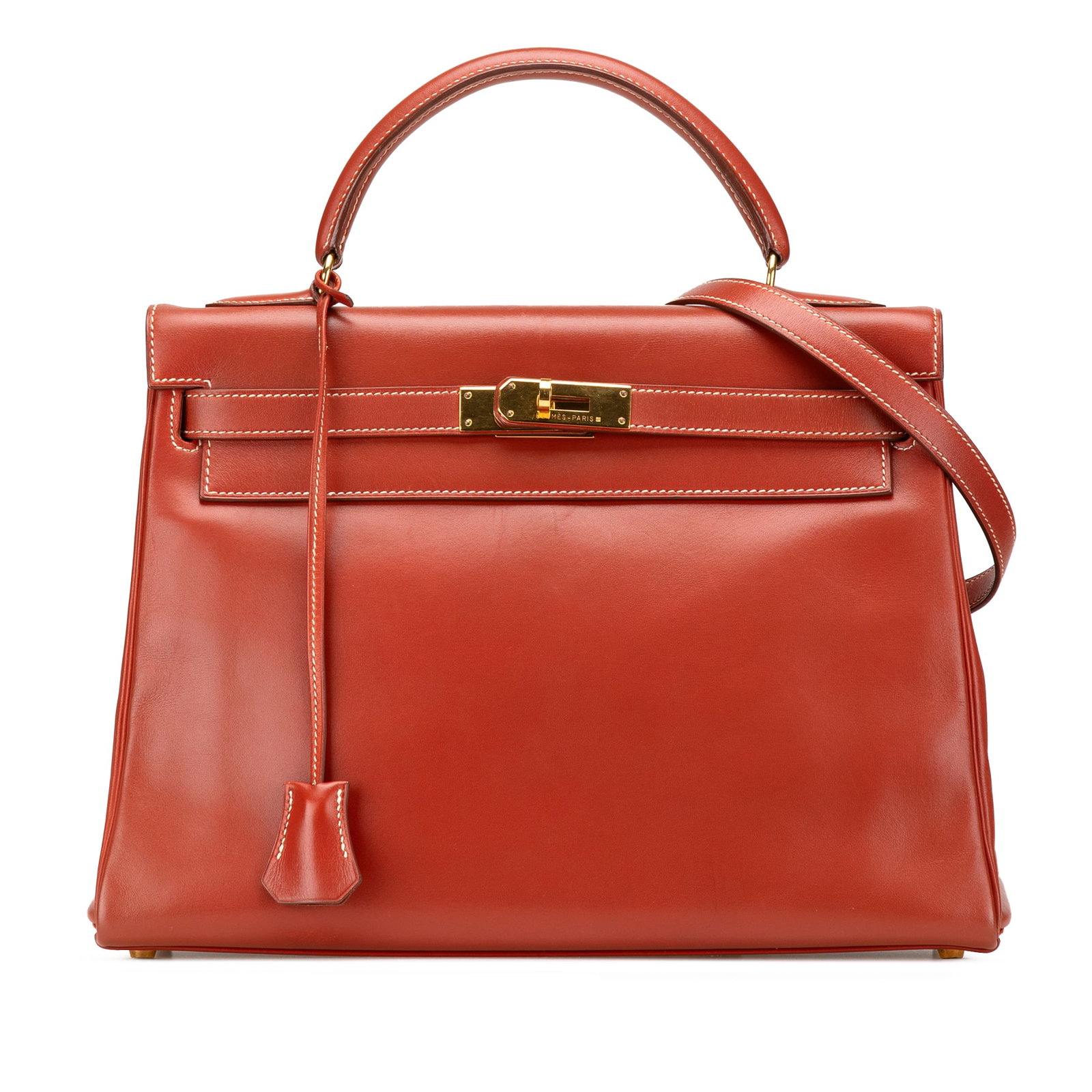 Hermes Box Calf Kelly Retourne 32 Brique Leather Handbag: Hermes Box Calf Kelly Retourne 32 Brique Leather Handbag The Hermes Box Calf Kelly Retourne 32 is a luxurious handbag crafted from premium Box Calf leather in a striking Brique color. This elegant pie