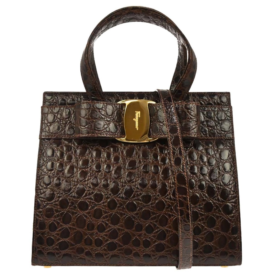 Vara Bow Medium Brown Leather Top Handle 2way Bag by Salvatore Ferragamo: Vara Bow Medium Brown Leather Top Handle 2way Bag by Salvatore Ferragamo This Salvatore Ferragamo Vara Bow 2-way handbag features a medium-sized silhouette crafted from brown leather. Designed for cas