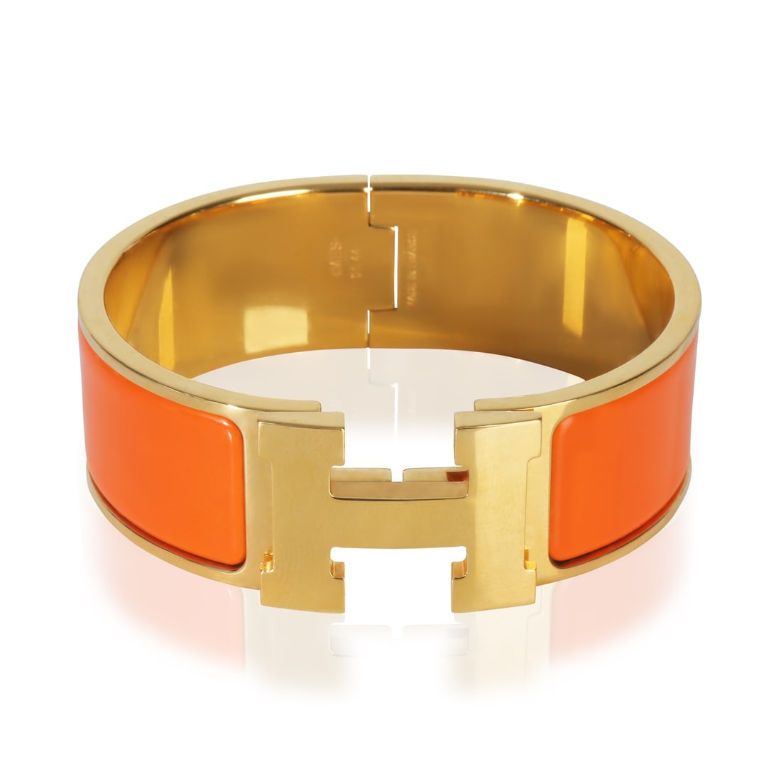 Hermes Clic Clac In Organe Fruite Gold Plated Bracelet with Box: Hermes Clic Clac In Organe Fruite Gold Plated Bracelet with Box This Hermes Clic Clac In Organe Fruite bracelet features a gold-plated design with a pusher clasp. The bracelet is from the Clic Clac co