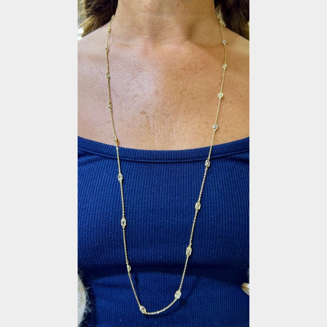 18K Yellow Gold 10.50 Ct Emerald-cut Diamond Necklace 33": 18K Yellow Gold 10.50 Ct Emerald-cut Diamond Necklace 33" This stunning necklace features a beautiful arrangement of 22 emerald-cut diamonds, totaling approximately 10.50 carats, set in luxurious 18K