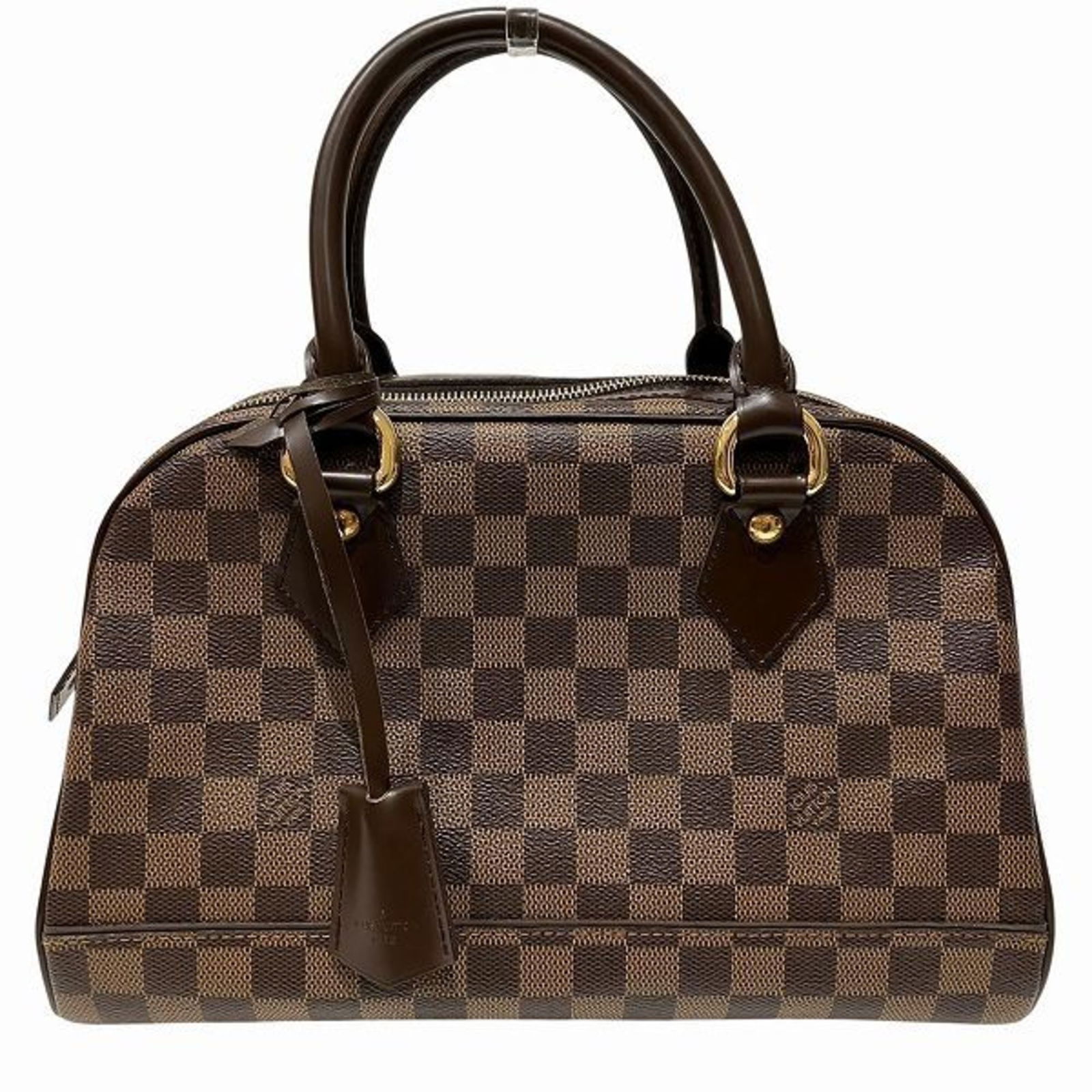 Duomo Canvas Handbag in Brown by Louis Vuitton: Duomo Canvas Handbag in Brown by Louis Vuitton The Louis Vuitton Duomo is a women's handbag crafted from brown canvas. Featuring a classic design, it is made in Spain and offers ample space with its s