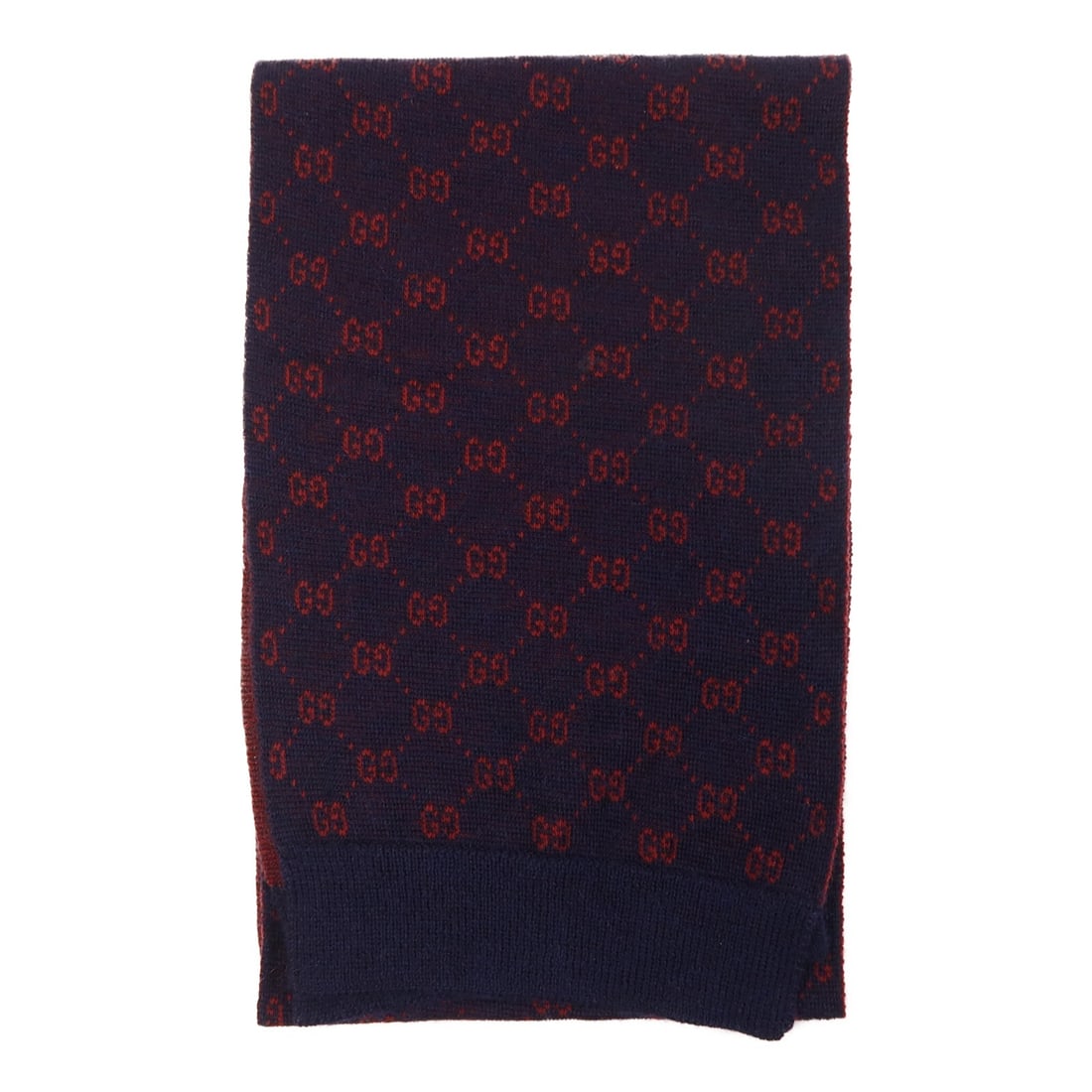 Blue and Red Wool GG Pattern Scarf by Gucci: Blue and Red Wool GG Pattern Scarf by Gucci This is a GUCCI GG scarf crafted from wool in blue and red tones. The scarf is a regular size and was manufactured in Italy. It is in B condition, indicatin