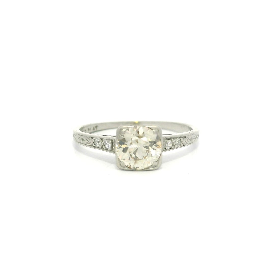 Antique Platinum 0.72ct Diamond Engraved Petite Solitaire Ring: Antique Platinum 0.72ct Diamond Engraved Petite Solitaire Ring This exquisite antique solitaire ring features a stunning 0.72ctw of natural diamonds set in premium platinum. The centerpiece is a beaut