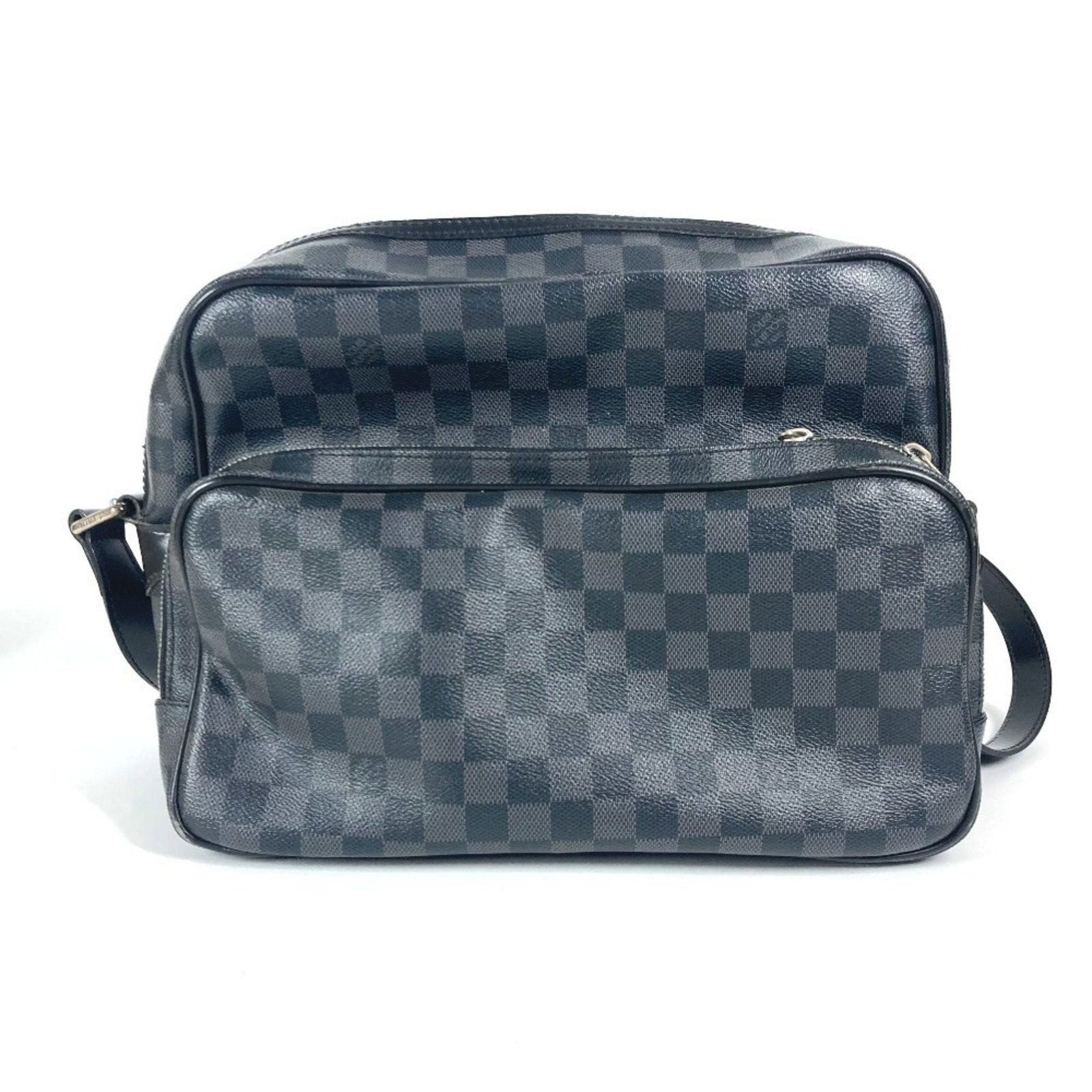 Leoh black canvas bag by Louis Vuitton: Leoh black canvas bag by Louis Vuitton This is a Louis Vuitton Leoh bag crafted from black canvas. Designed for any gender, it features a spacious interior and sturdy construction. The bag shows trace