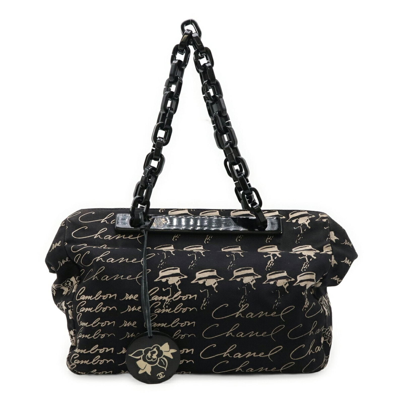 Chanel Camellia Black Canvas Handbag 22cm x 30cm x 13cm: Chanel Camellia Black Canvas Handbag 22cm x 30cm x 13cm This Chanel Camellia bag features a black canvas exterior and is designed for women. Crafted in France, it showcases the signature Camellia mode