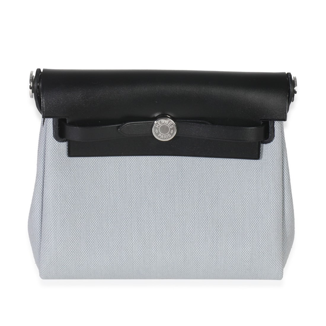 Hermes Herbag Zip Retourne 20 Blue Military Canvas Crossbody Bag: Hermes Herbag Zip Retourne 20 Blue Military Canvas Crossbody Bag Introducing the Hermes Herbag Zip Retourne 20, a versatile and stylish crossbody bag designed for unisex wear. Crafted in France, this