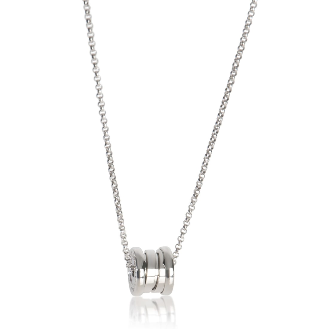 18k White Gold Mini B.zero1 Pendant Necklace by BVLGARI: 18k White Gold Mini B.zero1 Pendant Necklace by BVLGARI This BVLGARI Mini B.zero1 necklace is crafted from 18k white gold and features a classic design without any stones. The necklace measures 18 inc