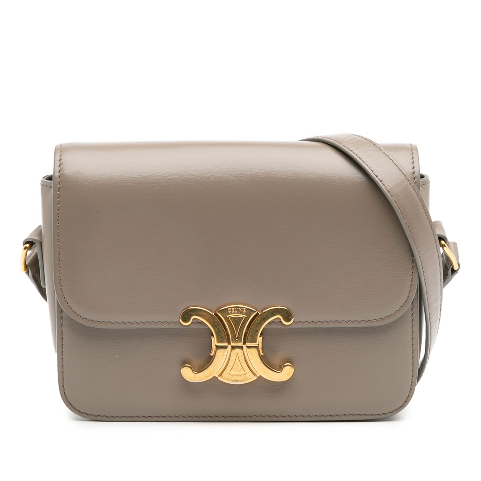 Celine Teen Shiny Calfskin Triomphe Brown Crossbody Bag: Celine Teen Shiny Calfskin Triomphe Brown Crossbody Bag Introducing the Celine Teen Shiny Calfskin Triomphe Crossbody, a sophisticated accessory crafted from premium leather. This stylish crossbody ba