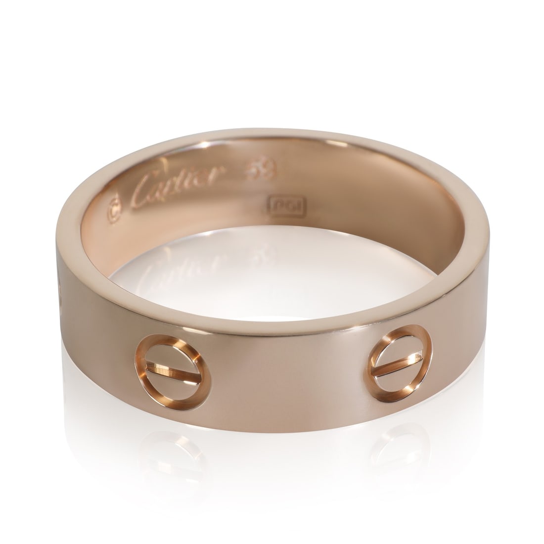 Cartier Love Collection 18k Rose Gold Unisex Ring With Box and Certificate: Cartier Love Collection 18k Rose Gold Unisex Ring With Box and Certificate This pre-owned Cartier Love ring from the renowned Love collection is crafted in 18k rose gold and features a chic pink hue.