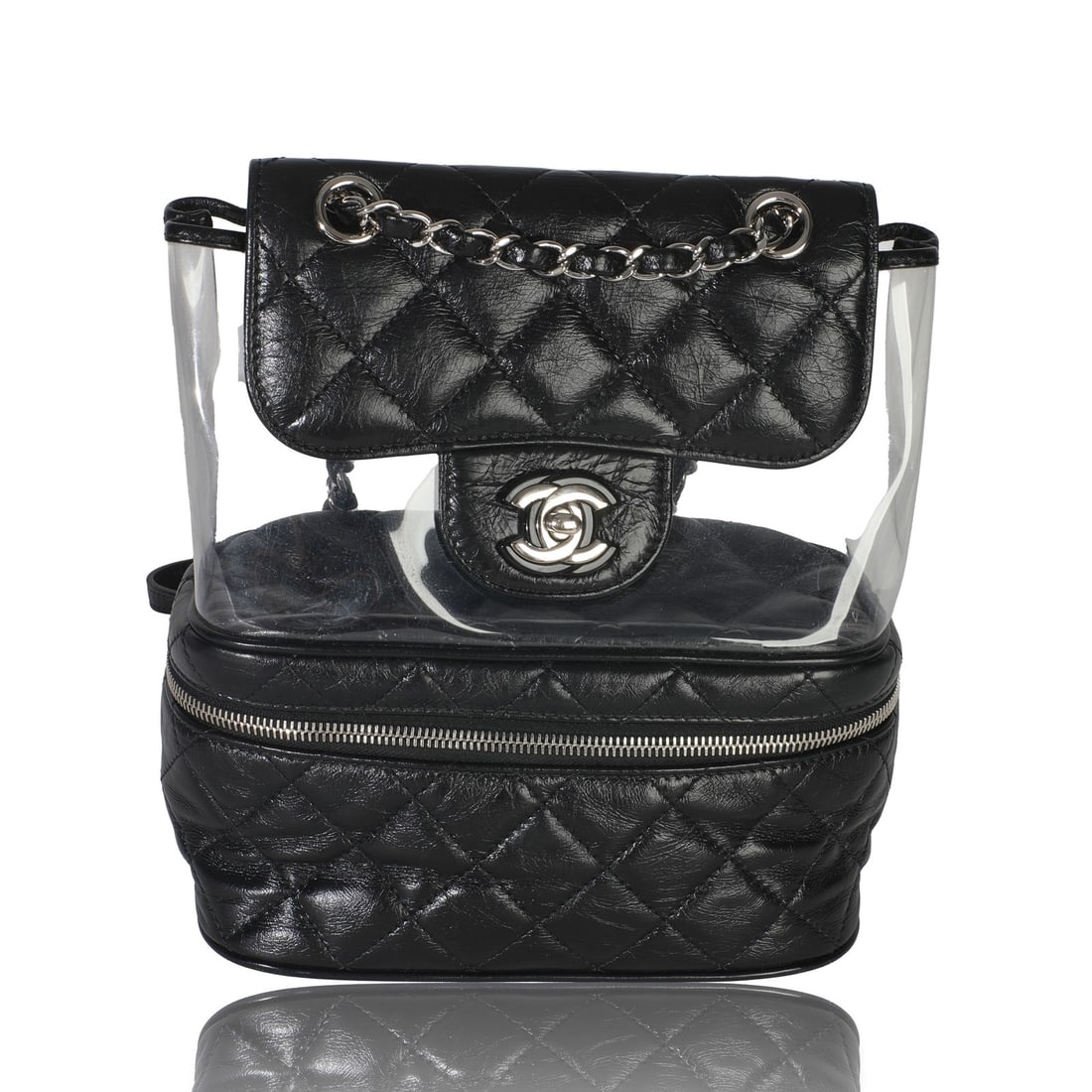 Mini Backpack by Chanel in Black Crumpled Calfskin and PVC: Mini Backpack by Chanel in Black Crumpled Calfskin and PVC This Chanel Mini Backpack features black crumpled calfskin leather and PVC, offering a stylish and durable design. The bag has a turnlock clo