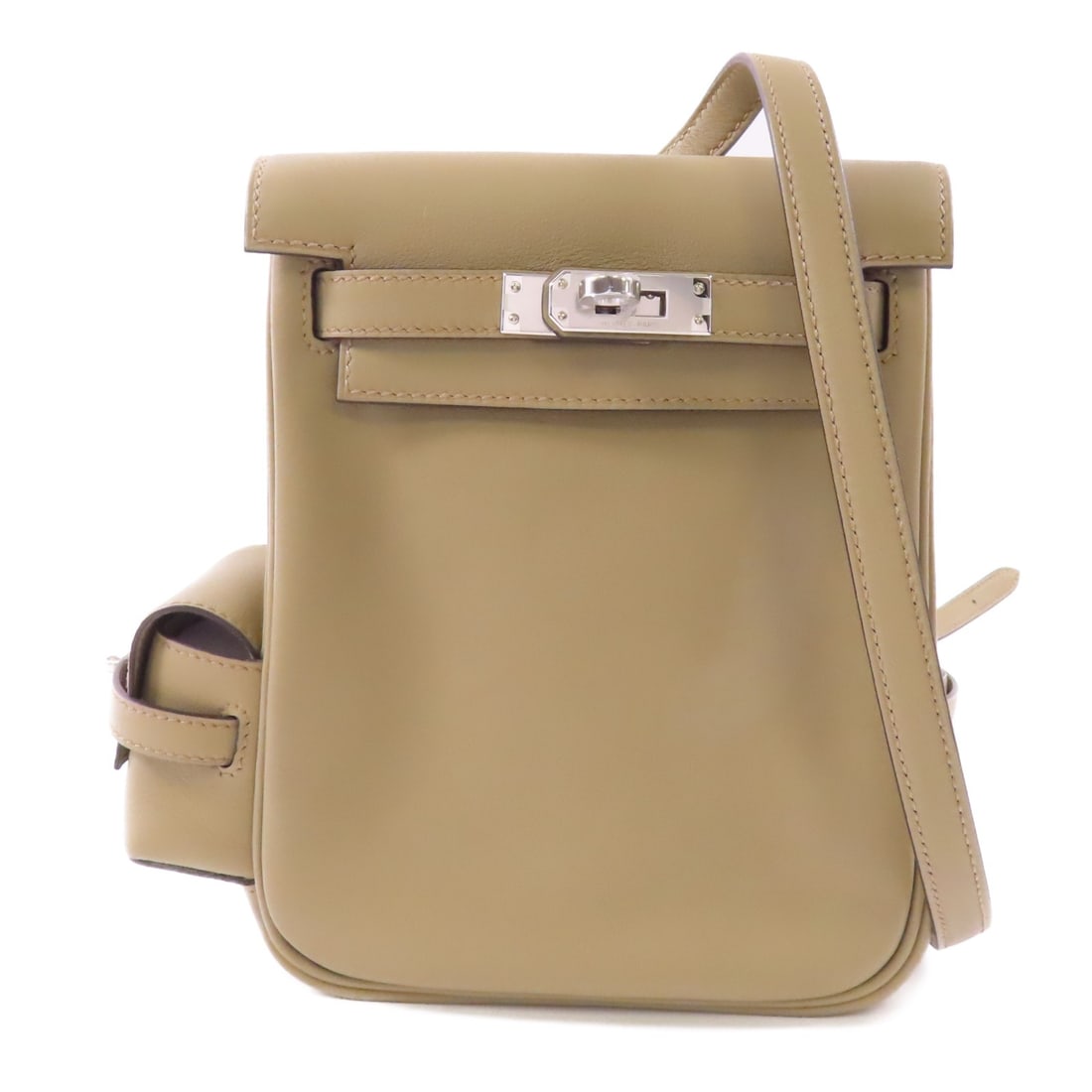Hermes Kelly Jump Veau Swift Leather Rucksack Backpack in Beige: Hermes Kelly Jump Veau Swift Leather Rucksack Backpack in Beige This Hermes Kelly Jump Rucksack features premium Veau Swift leather in an elegant beige color. The backpack offers a pristine, un-used c