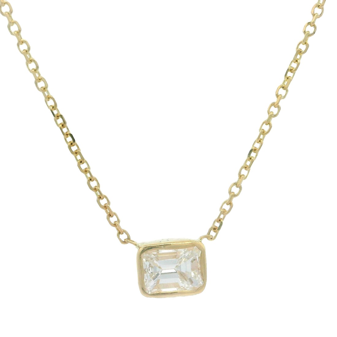 14k Yellow Gold 0.36ct Emerald Cut Diamond Pendant Necklace: 14k Yellow Gold 0.36ct Emerald Cut Diamond Pendant Necklace This exquisite pendant necklace features a stunning natural emerald cut diamond, expertly bezel set in solid 14k yellow gold. The diamond me