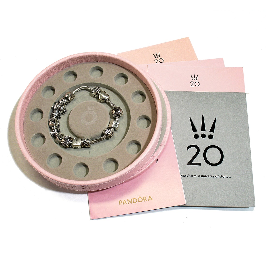 Limited Edition 2020 PANDORA Sterling Silver & Yellow Gold Moments Bracelet with Charms: Limited Edition 2020 PANDORA Sterling Silver & Yellow Gold Moments Bracelet with Charms Discover the elegance of the Limited Edition 2020 Pandora Silver Moments Bracelet, featuring exquisite charms an