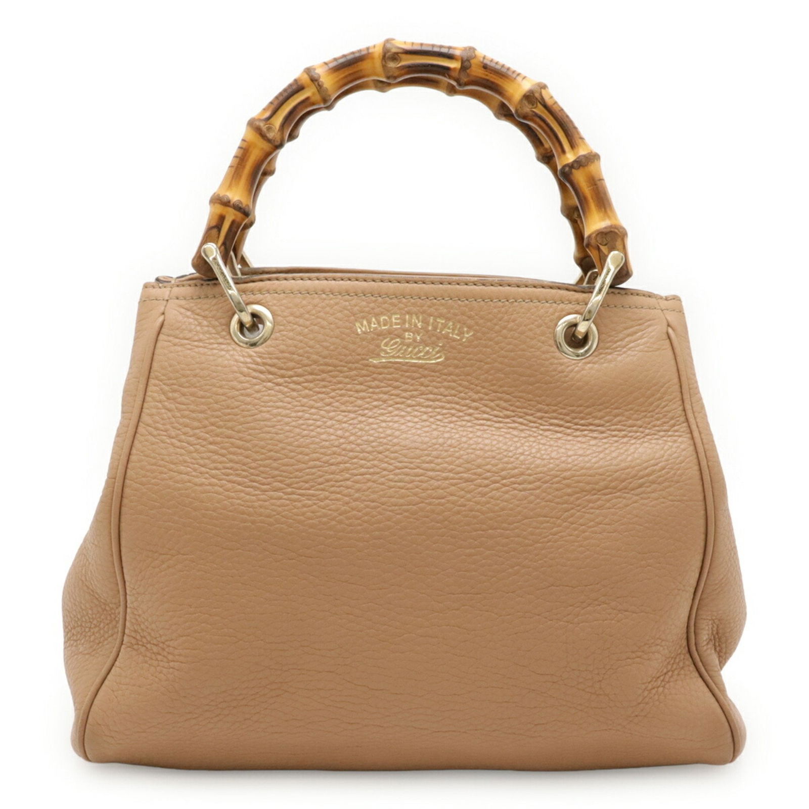 Brown Leather Bamboo Handbag by Gucci Italy: Brown Leather Bamboo Handbag by Gucci Italy This Gucci Bamboo handbag features a brown leather exterior and bamboo handle, designed specifically for women. The bag is crafted in Italy and offers a spa