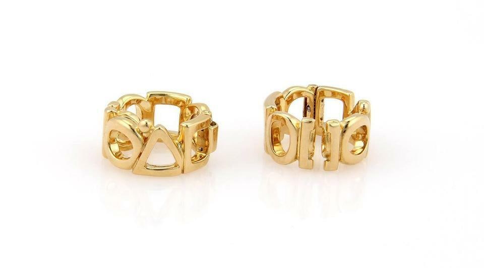 Chanel 18k Yellow Gold Geometric Clip-On Huggie Earrings: Chanel 18k Yellow Gold Geometric Clip-On Huggie Earrings Elevate your accessory collection with these stunning authentic Chanel clip-on hoop earrings. Crafted from luxurious 18k yellow gold, these ear