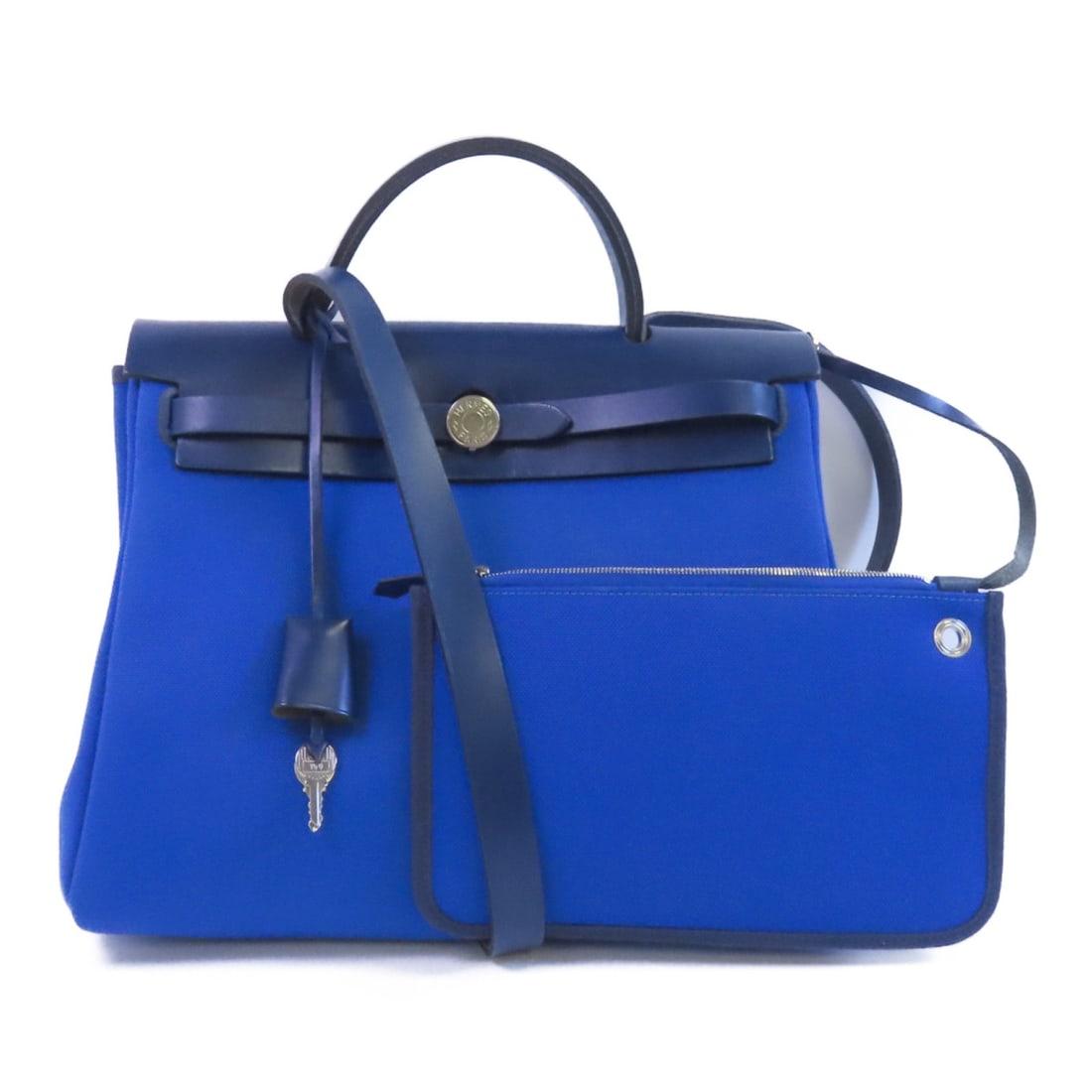 Herbag PM Blue Canvas 2-Way Shoulder Bag with Palladium Hardware by Hermes: Herbag PM Blue Canvas 2-Way Shoulder Bag with Palladium Hardware by Hermes This Hermes Herbag PM is a versatile 2-way shoulder bag crafted from blue canvas, featuring a classic design with both hand a