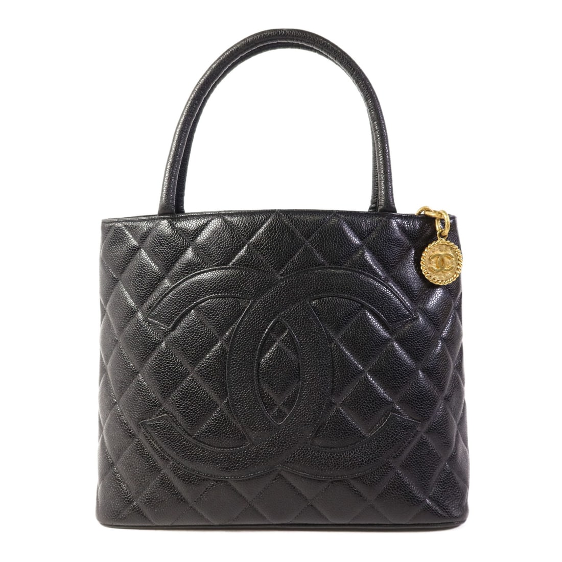 CHANEL Vintage Tote Bag Black Calfskin Leather GHW: CHANEL Vintage Tote Bag Black Calfskin Leather GHW This vintage CHANEL CC Tote Bag is crafted from luxurious black calfskin leather, showcasing a timeless design perfect for any occasion. The bag feat