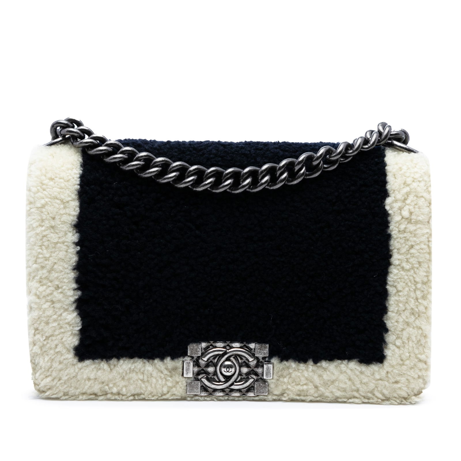 Chanel Old Medium Bicolor Shearling Boy Flap Bag: Chanel Old Medium Bicolor Shearling Boy Flap Bag This Chanel Old Medium Bicolor Shearling Boy Flap bag showcases a luxurious design with a soft fur body complemented by leather trim. It features a sty