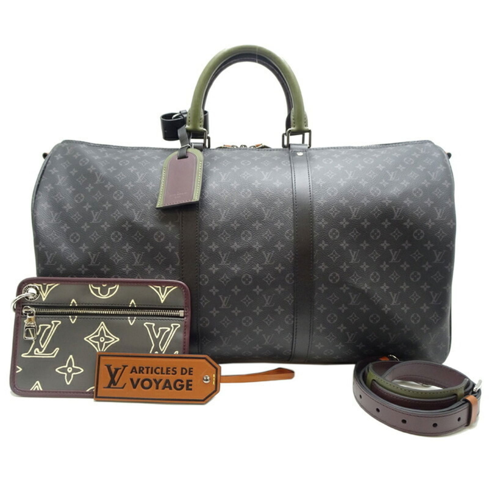 Louis Vuitton Keepall Bandouliere 50 black canvas travel bag: Louis Vuitton Keepall Bandouliere 50 black canvas travel bag The Louis Vuitton Keepall Bandouliere 50 is a versatile travel bag crafted from black canvas. It features both handles and an adjustable st