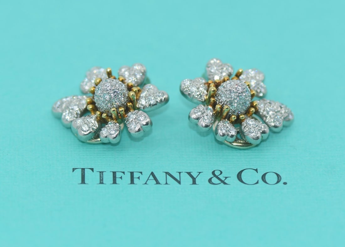 Tiffany & Co Schlumberger Diamond 18K Platinum Stud Earrings: Tiffany & Co Schlumberger Diamond 18K Platinum Stud Earrings Elevate your elegance with these exquisite Tiffany & Co. Schlumberger Cones & Petals Diamond Earrings. Crafted from a luxurious blend of 18