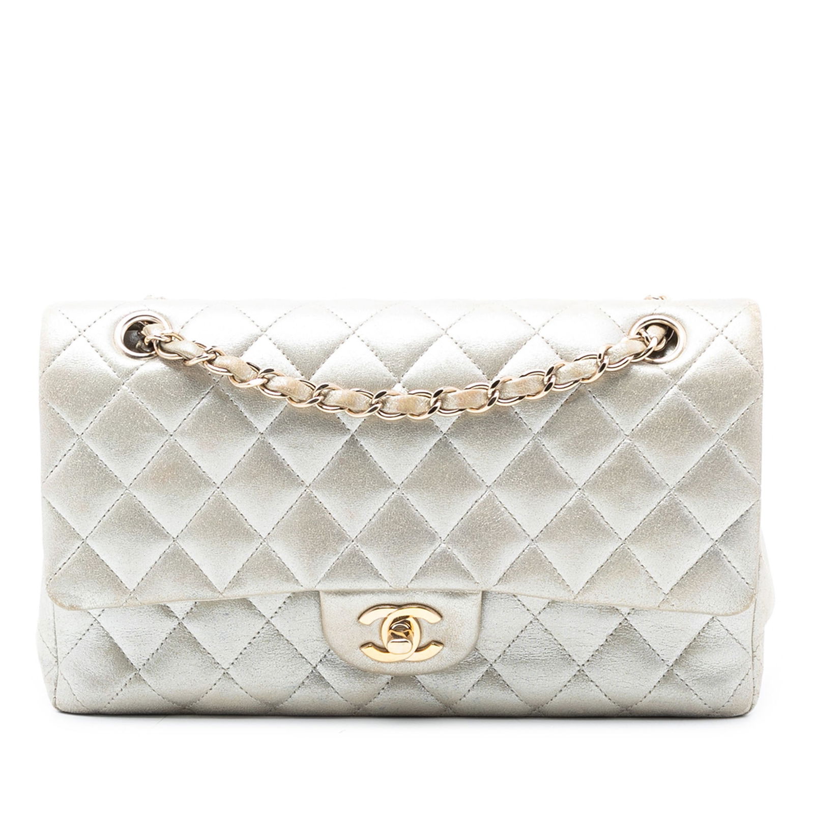 Chanel Medium Iridescent Lambskin Quilted Double Flap Shoulder Bag Gold: Chanel Medium Iridescent Lambskin Quilted Double Flap Shoulder Bag Gold This Chanel Medium Classic Flap bag is crafted from quilted iridescent metallic lambskin leather in gold, featuring a leather-wo